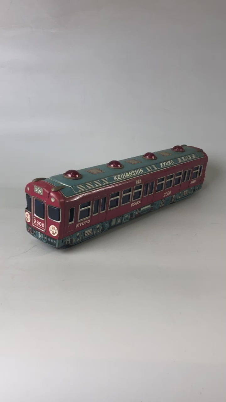 Y7032 [VIDEO] TIN TOY train Keihanshin 2300 transportation